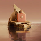 Amouage Guidance Eau de Parfum luxury pink perfume bottle with gold details, representing an elegant amber floral fragrance.