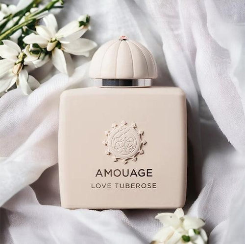 Amouage Love Tuberose Eau de Parfum bottle displayed in a luxury setting, highlighting its creamy white floral fragrance with vanilla undertones.