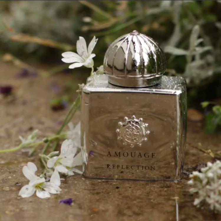 Amouage Reflection Eau de Parfum luxury perfume bottle with elegant white and silver design, symbolizing a floral woody fragrance.