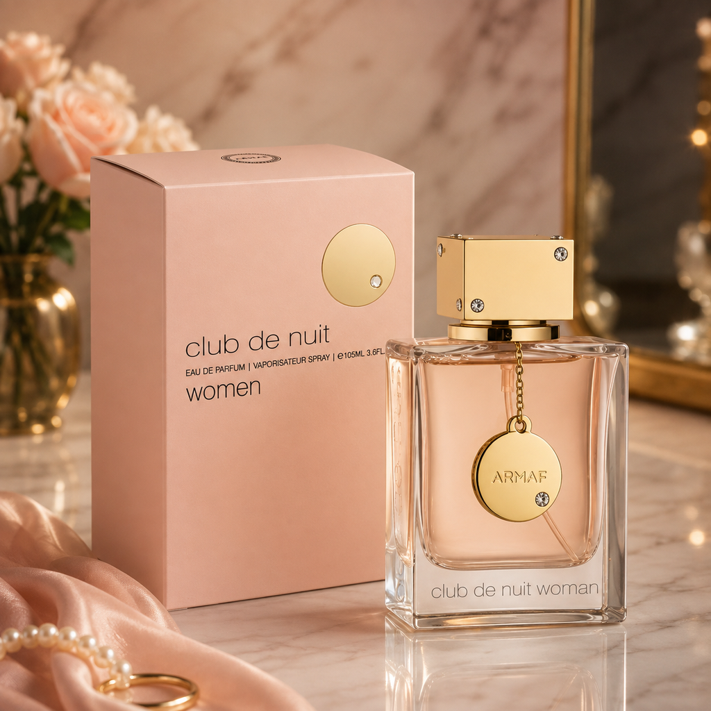 Armaf Club de Nuit Woman Eau de Parfum 105ml with pink box and gold cap displayed on a premium marble background.