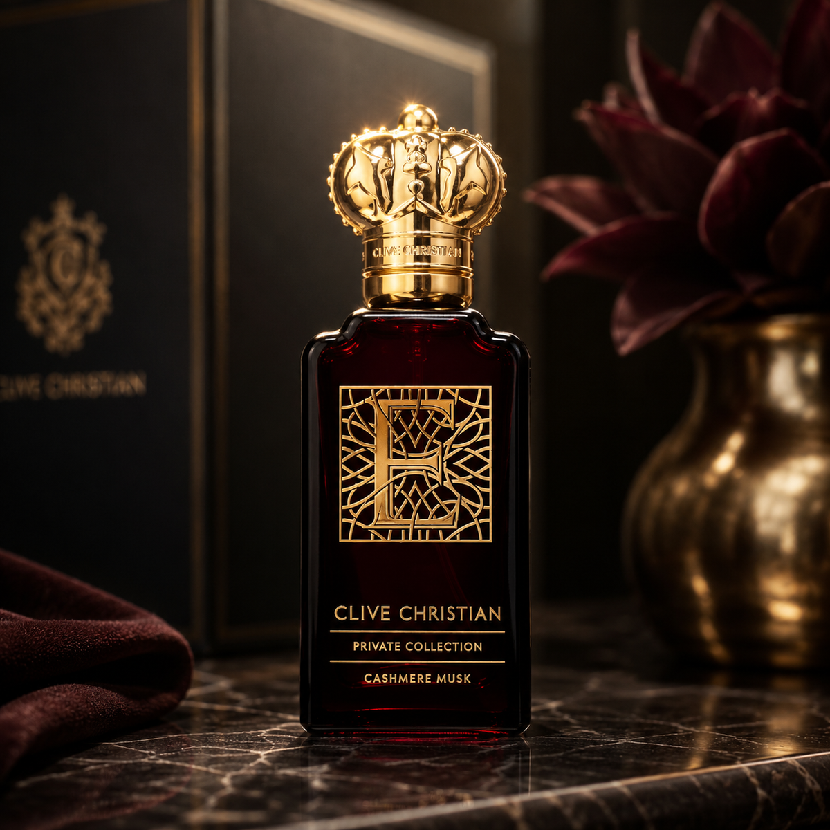 Clive Christian Cashmere Musk Private Collection luxury Eau de Parfum in a dark red bottle with gold crown cap on premium marble background.